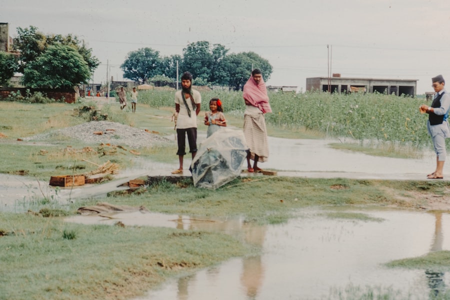 People on a flooded rural road