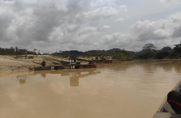 Mining washing plant discharging sediment into a river